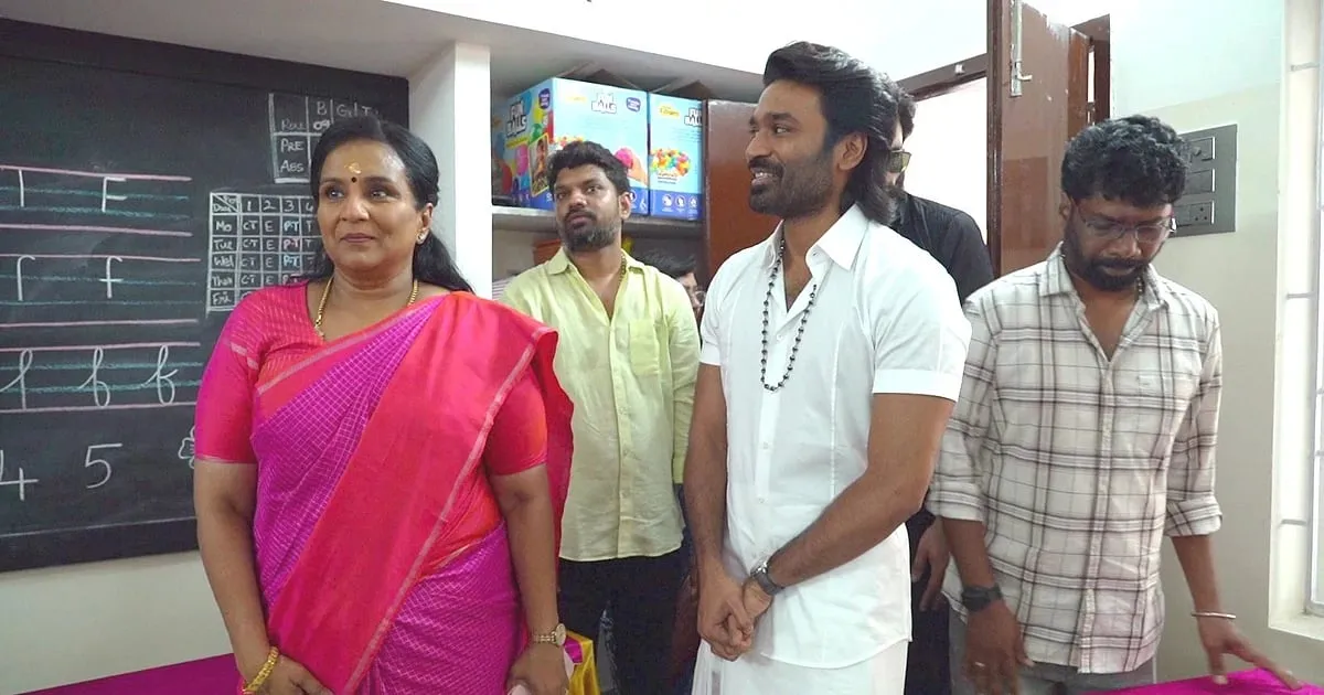 Dhanush touring a classroom at Thai Sathya school in Saligramam during the new block inauguration