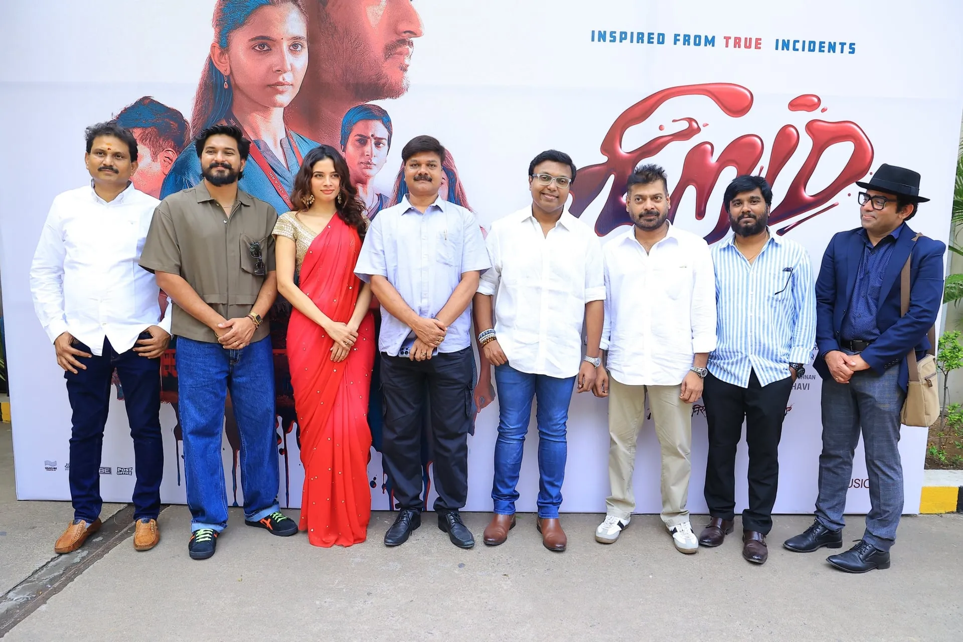 The Niram team at the film's audio and trailer launch, in front of the film's poster