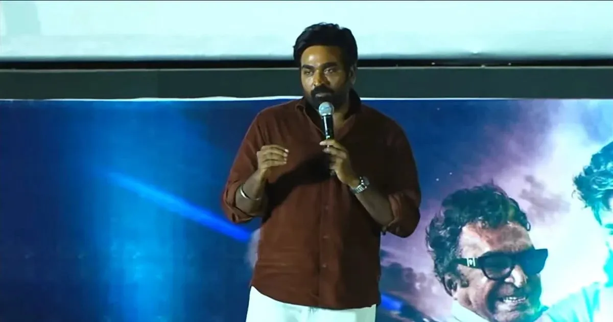 Vijay Sethupathi speaking at the Train teaser launch in front of the film's poster