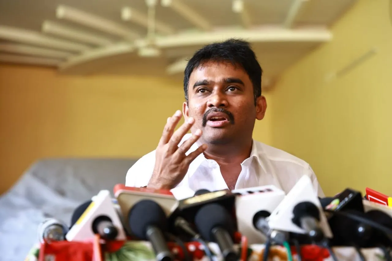 Jaffer Sadiq speaking at a press conference about the IT raids on his properties