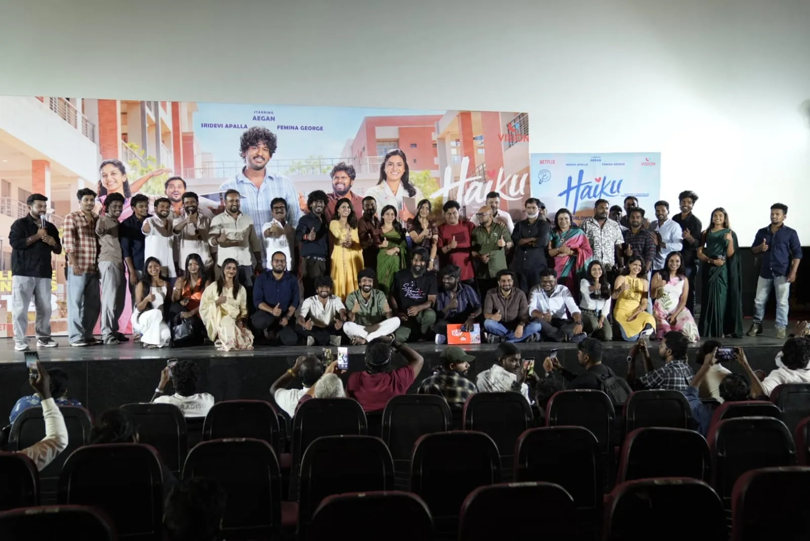 The Haiku cast, crew and guests gather on stage in front of the film's posters at the audio launch