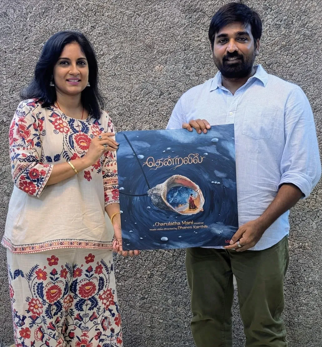 Vijay Sethupathi launches Charulatha Mani's Thendralil, holding the single's cover art.