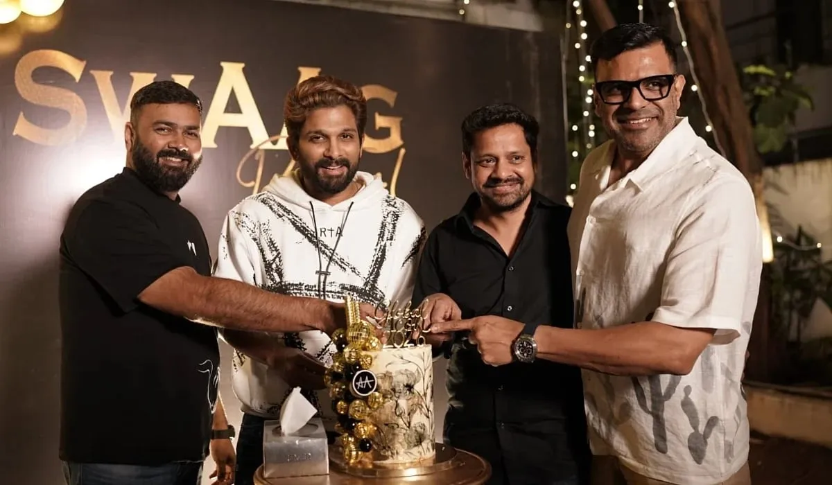 Allu Arjun cutting a celebration cake alongside three friends