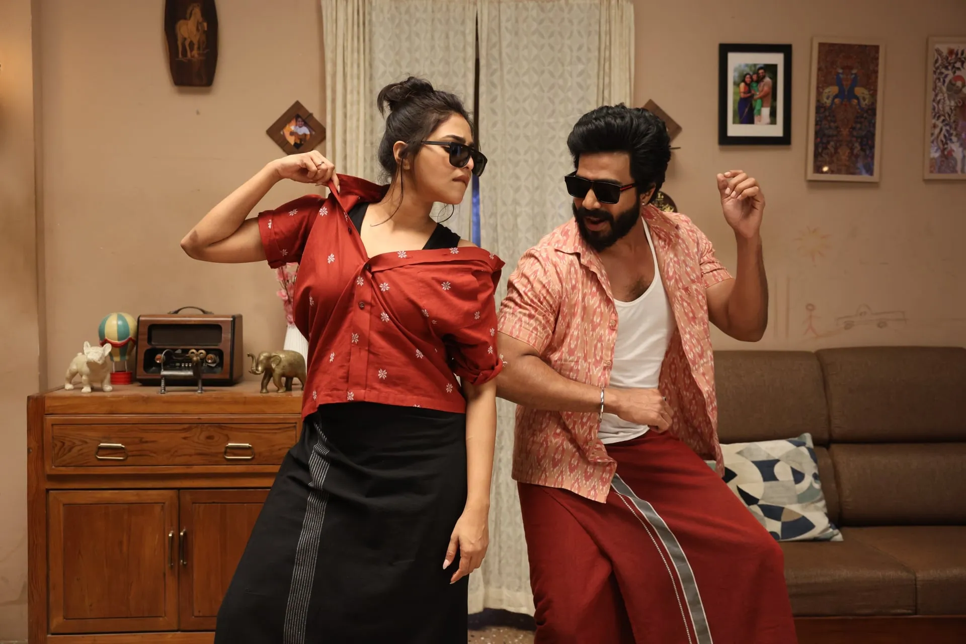 Vishnuu Vishal and Aishwarya Lekshmi in sunglasses, mid dance step in their living room in Gatta Kusthi 2