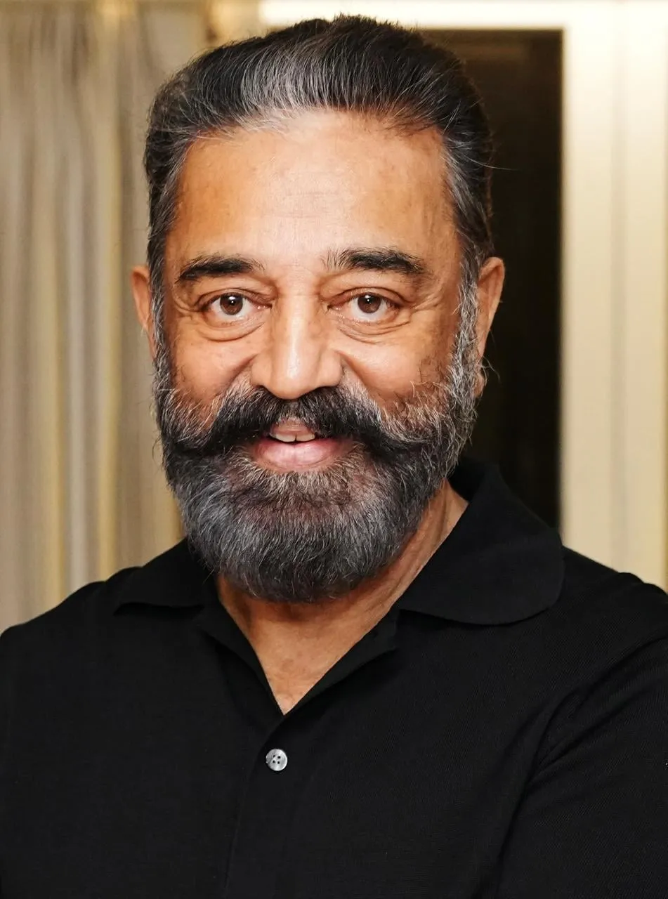 Kamal Haasan in a black shirt, photographed in close-up