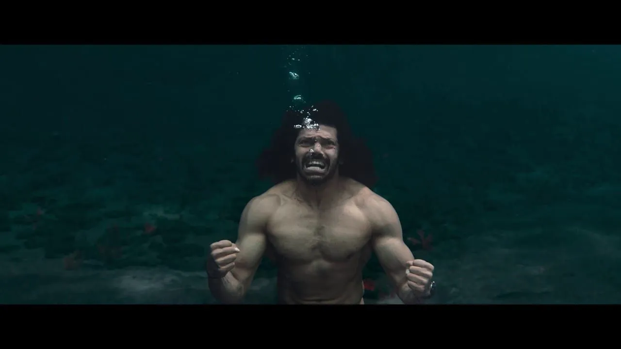 Arya submerged underwater with fists clenched in a still from Mr X