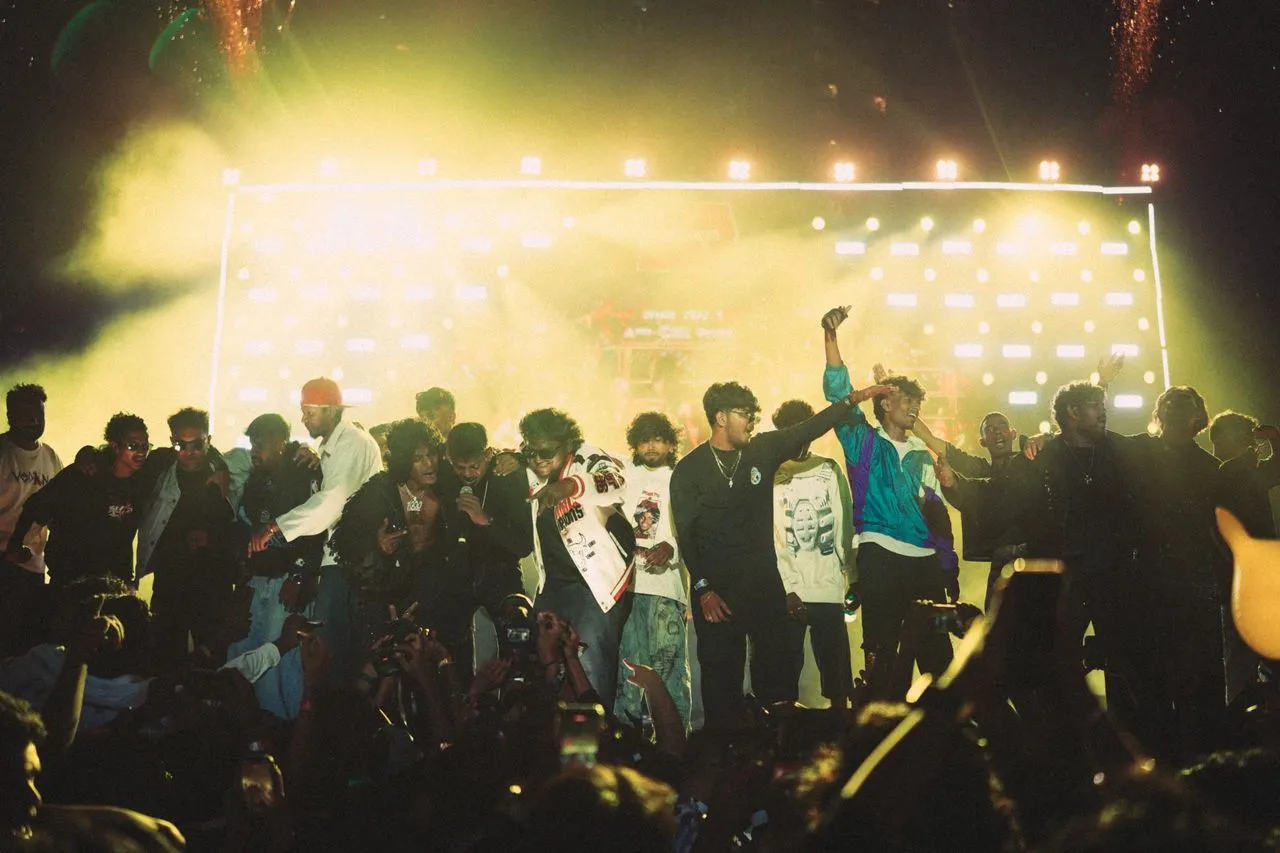 Artists on stage at Vanakkam Vanakkam Bengaluru with the crowd in front
