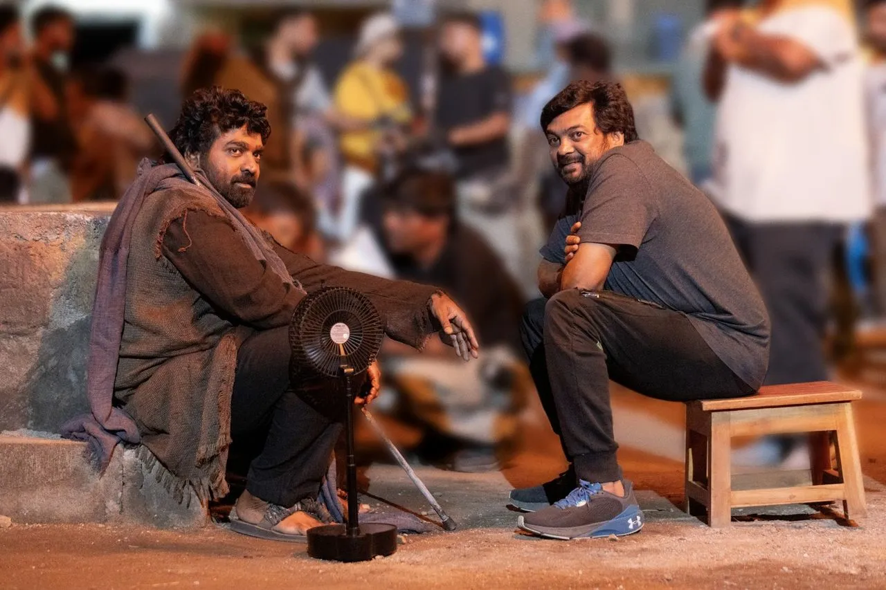 Vijay Sethupathi in character beside director Puri Jagannadh on the Slum Dog set