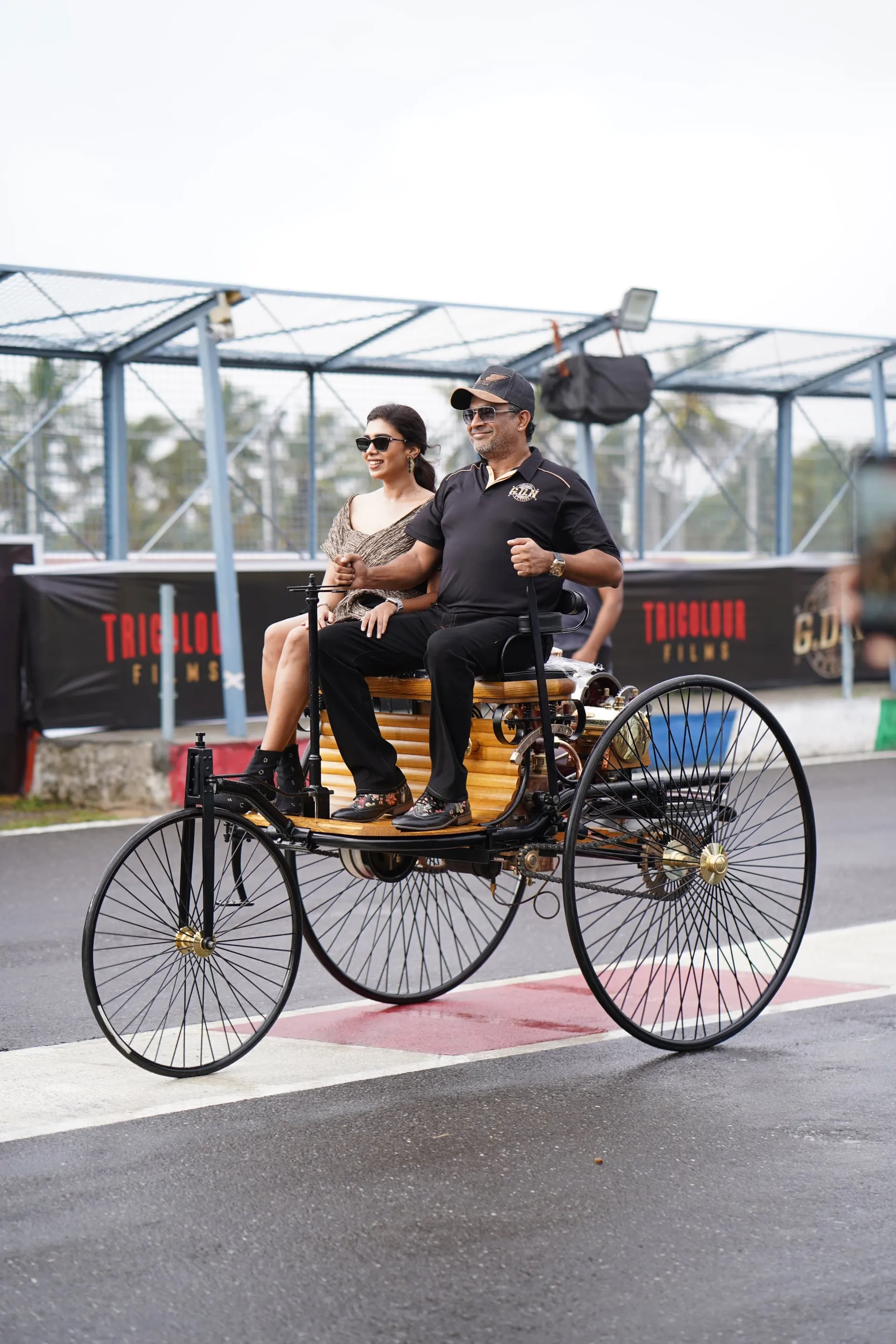 R. Madhavan and Dushara Vijayan on a vintage motor car at the GDN trailer launch at Kari Motor Speedway