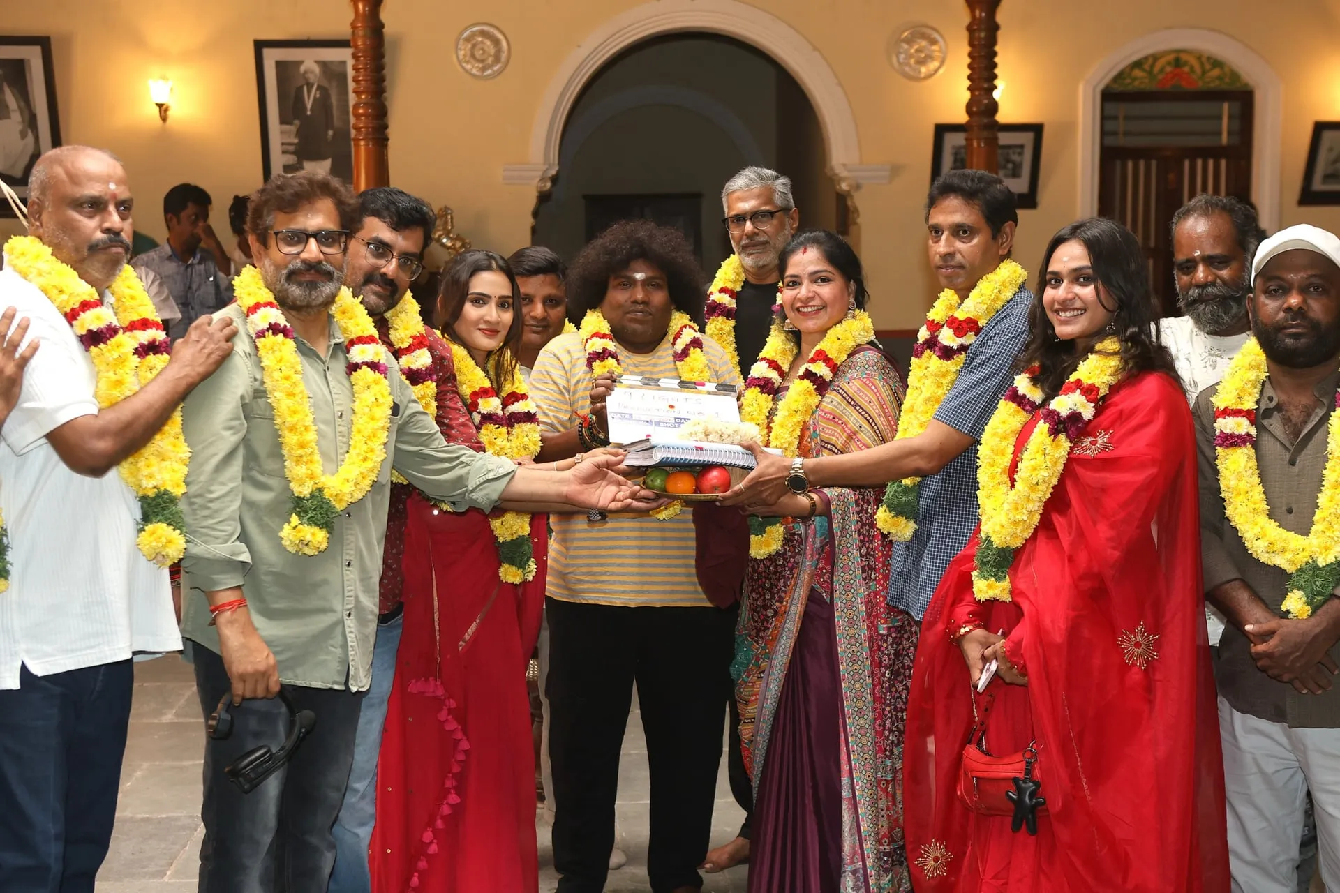Yogi Babu garlanded at the pooja of the 9 Lights film in which he plays 11 roles