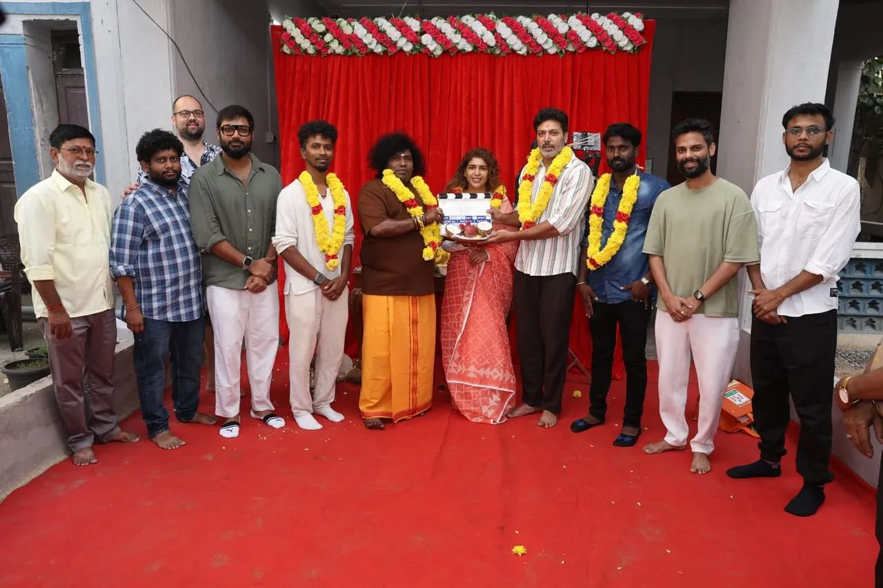 An Ordinary Man cast and crew at the puja ceremony with the clapboard