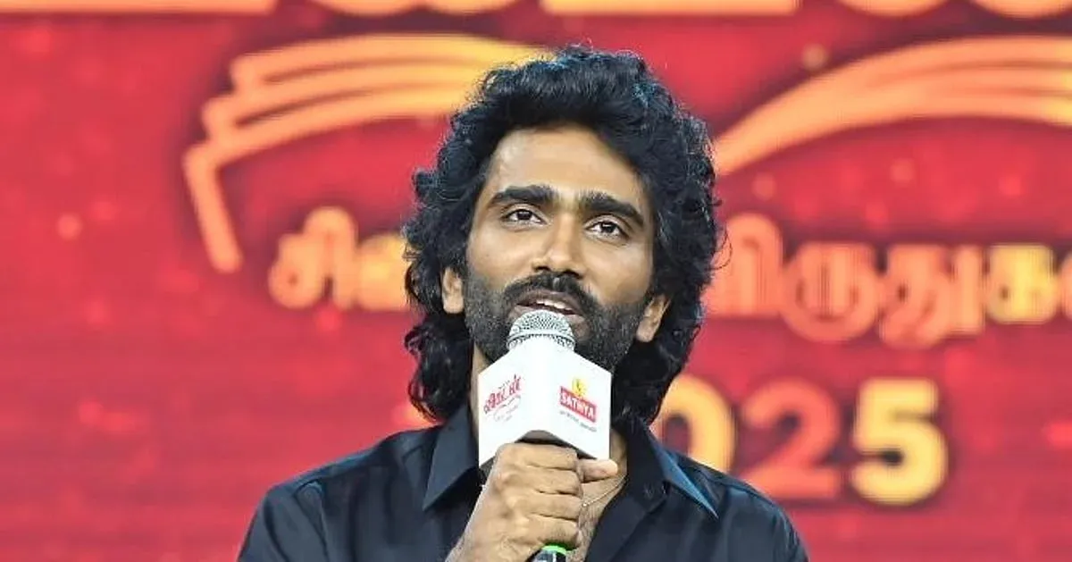 Pradeep Ranganathan speaking on stage after his Best Actor win at the Ananda Vikatan Cinema Awards