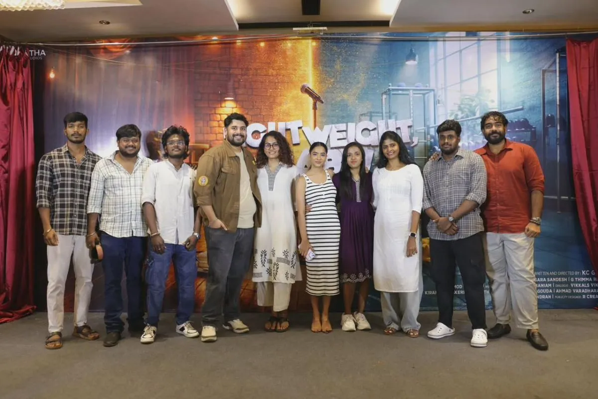 The Lightweight Baby cast and crew in front of the film backdrop