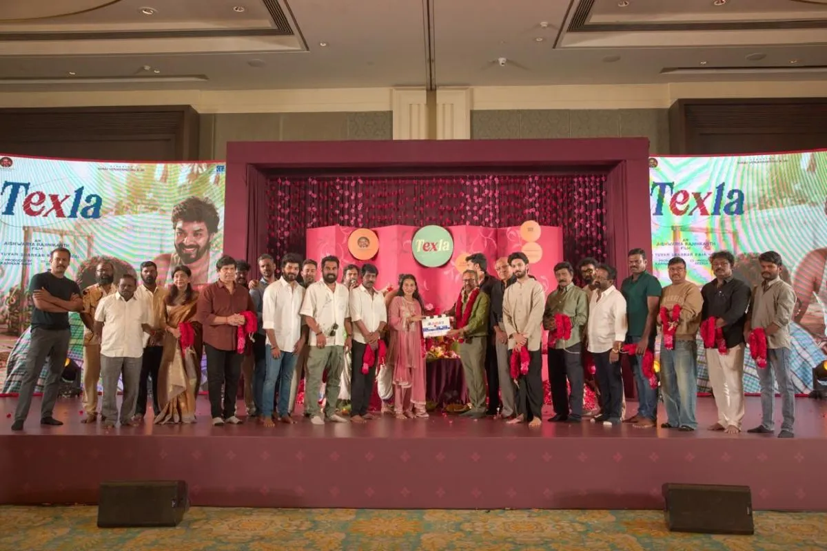 Full Texla cast and crew on stage with the clapboard at the launch event