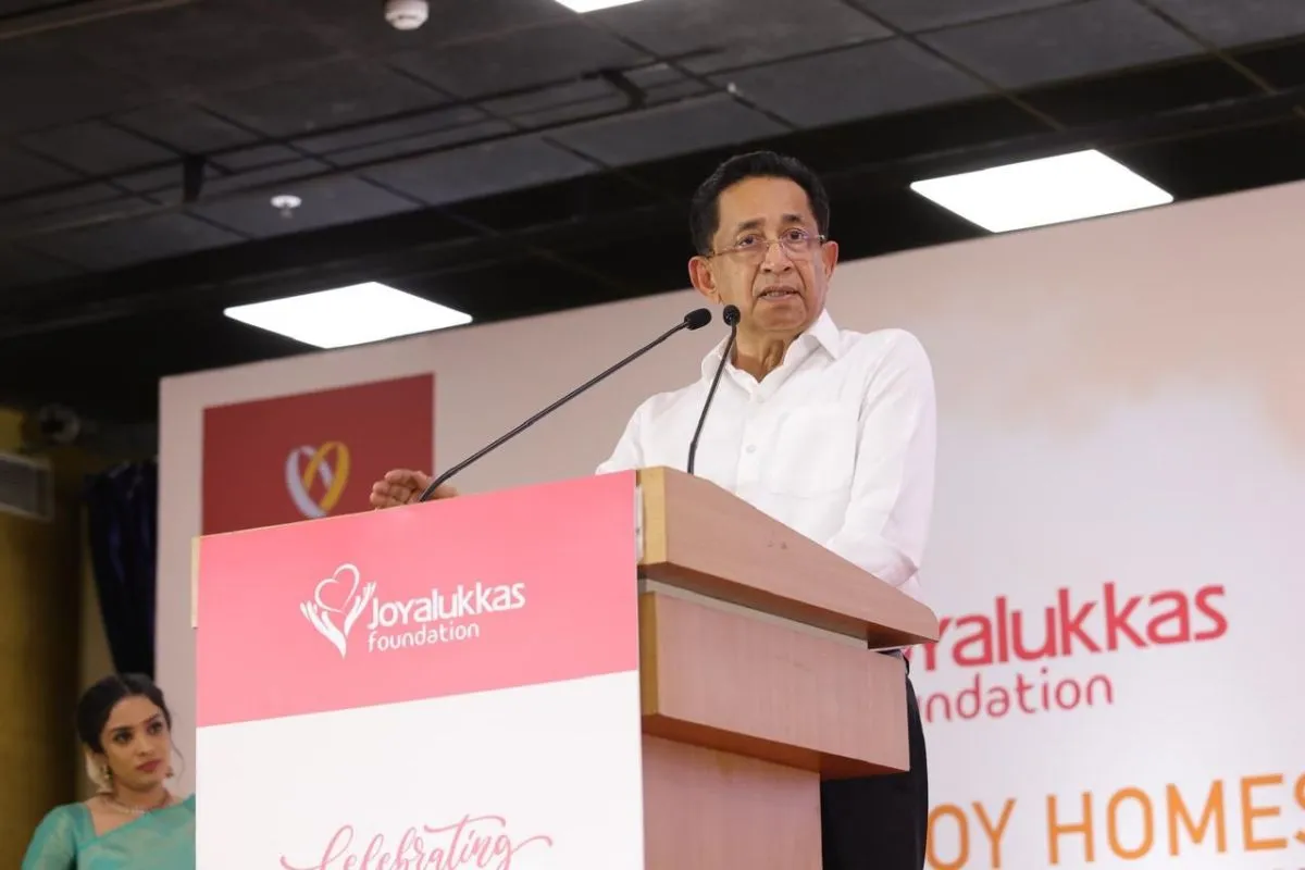 Joy Alukkas speaking at the Joy Homes ceremony at Joyalukkas Foundation event