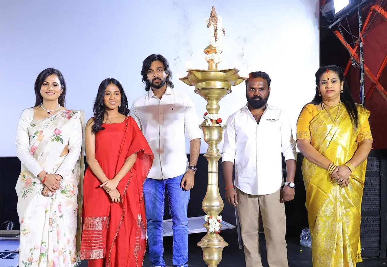 The Arulvaan team lights the ceremonial lamp at the film's launch.