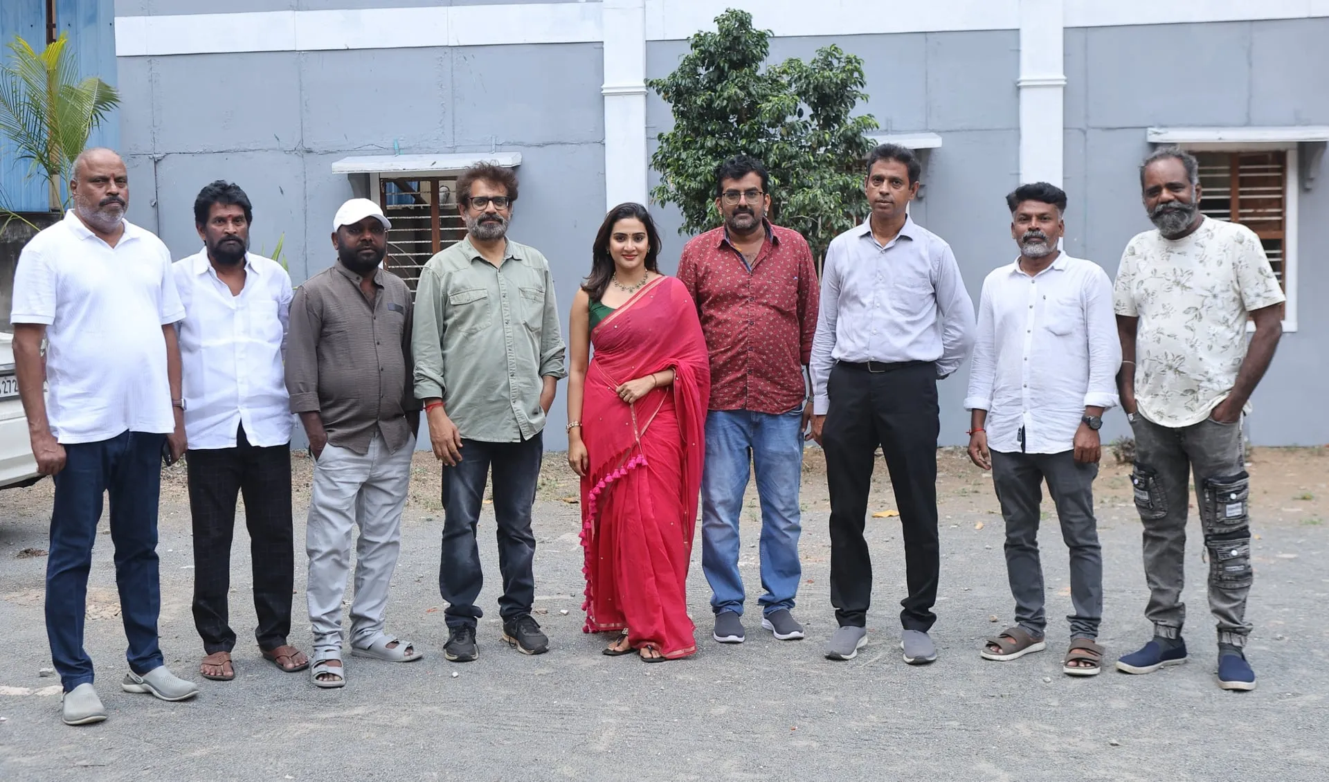 Cast and crew of the Yogi Babu film at the launch, with lead actress Aditi Ravi