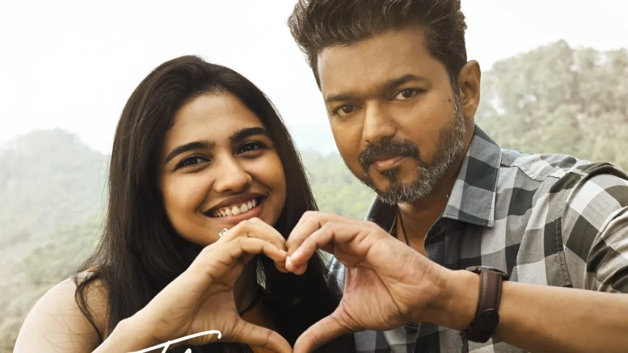 Vijay and Mamitha Baiju forming a heart with their hands in a still from Jana Nayagan