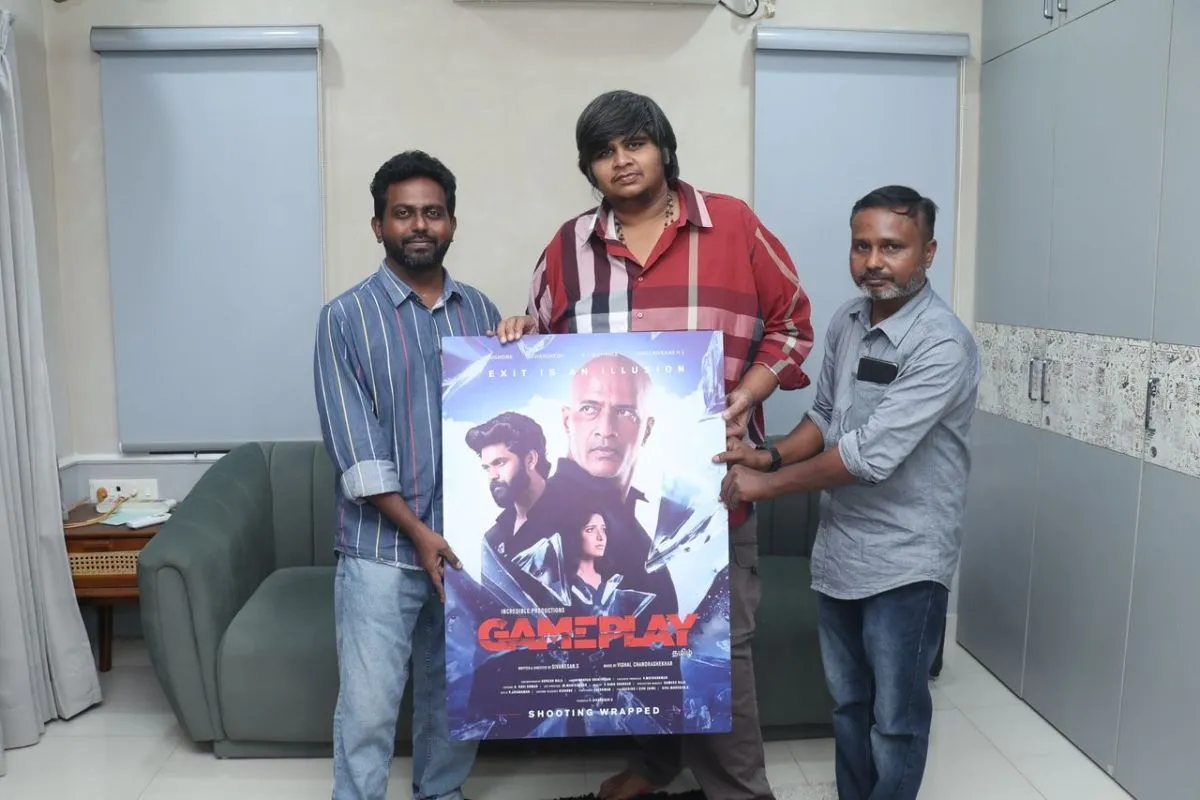 Karthik Subbaraj unveiling the Game Play first look poster with the team