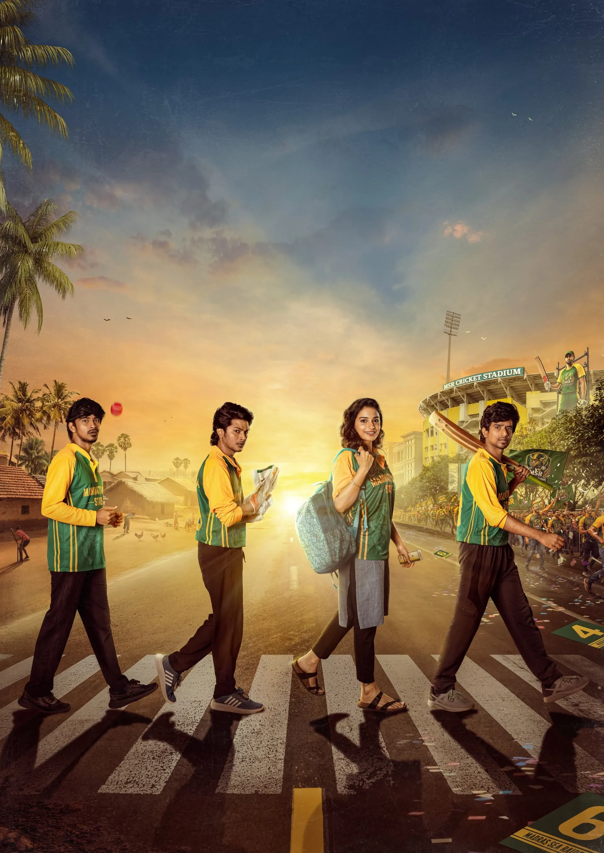 The four friends and their companion crossing a sunlit road toward a stadium, kit bags slung over shoulders, a cricket bat resting on one boy's neck.