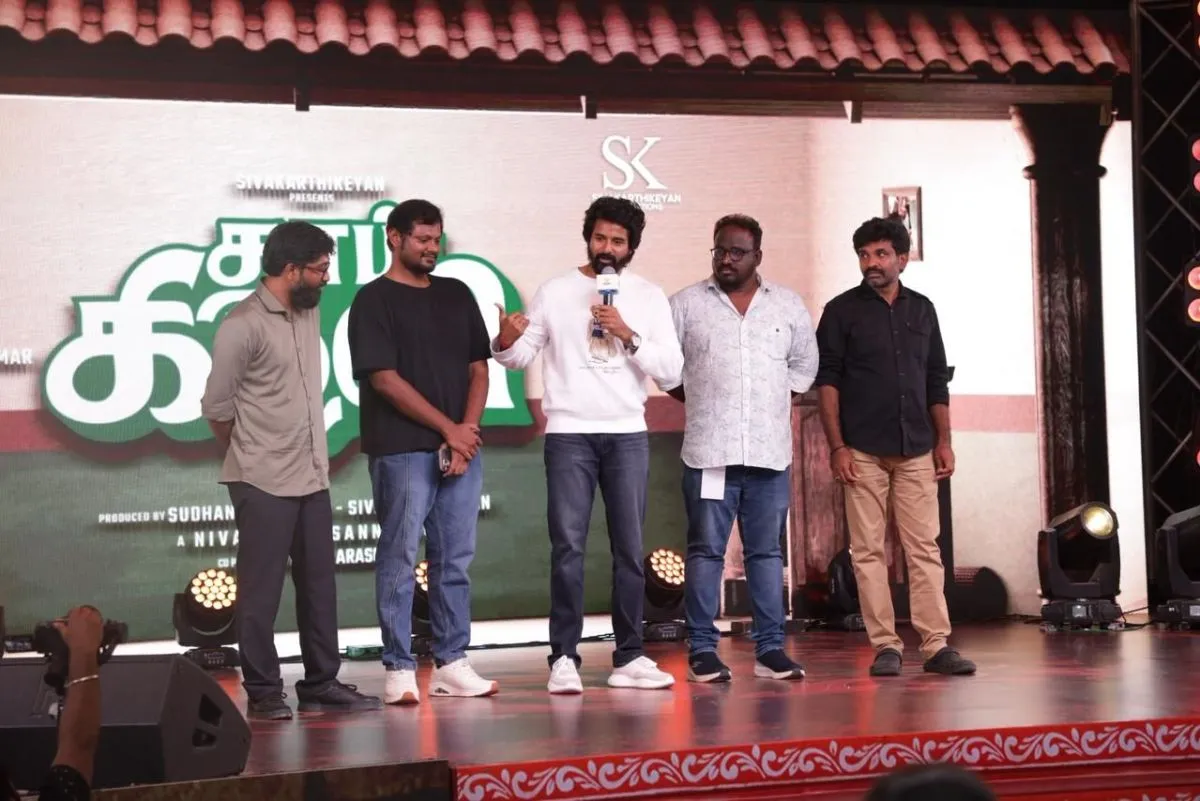 Sivakarthikeyan speaking on stage at the Thaai Kizhavi event