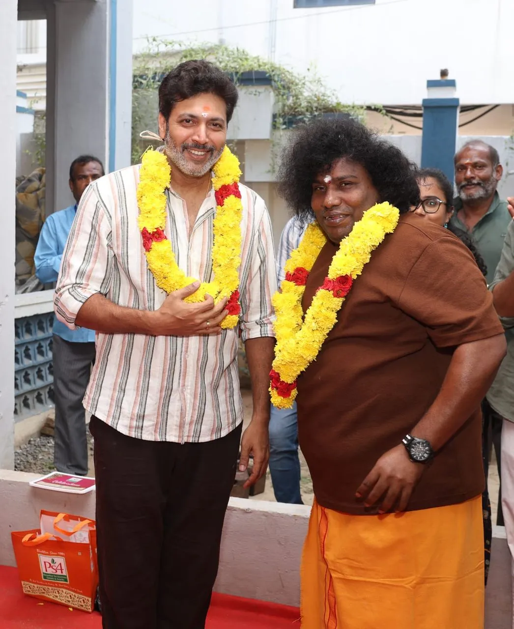 Director Ravi Mohan and lead actor Yogi Babu garlanded at the An Ordinary Man launch