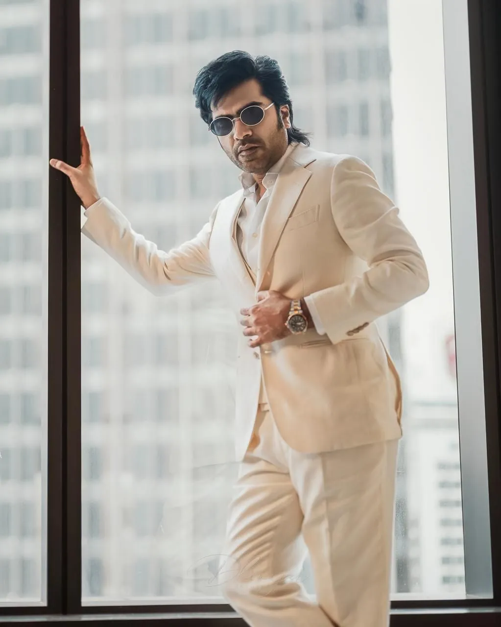 Silambarasan TR in a stylish still shared from the sets of Arasan