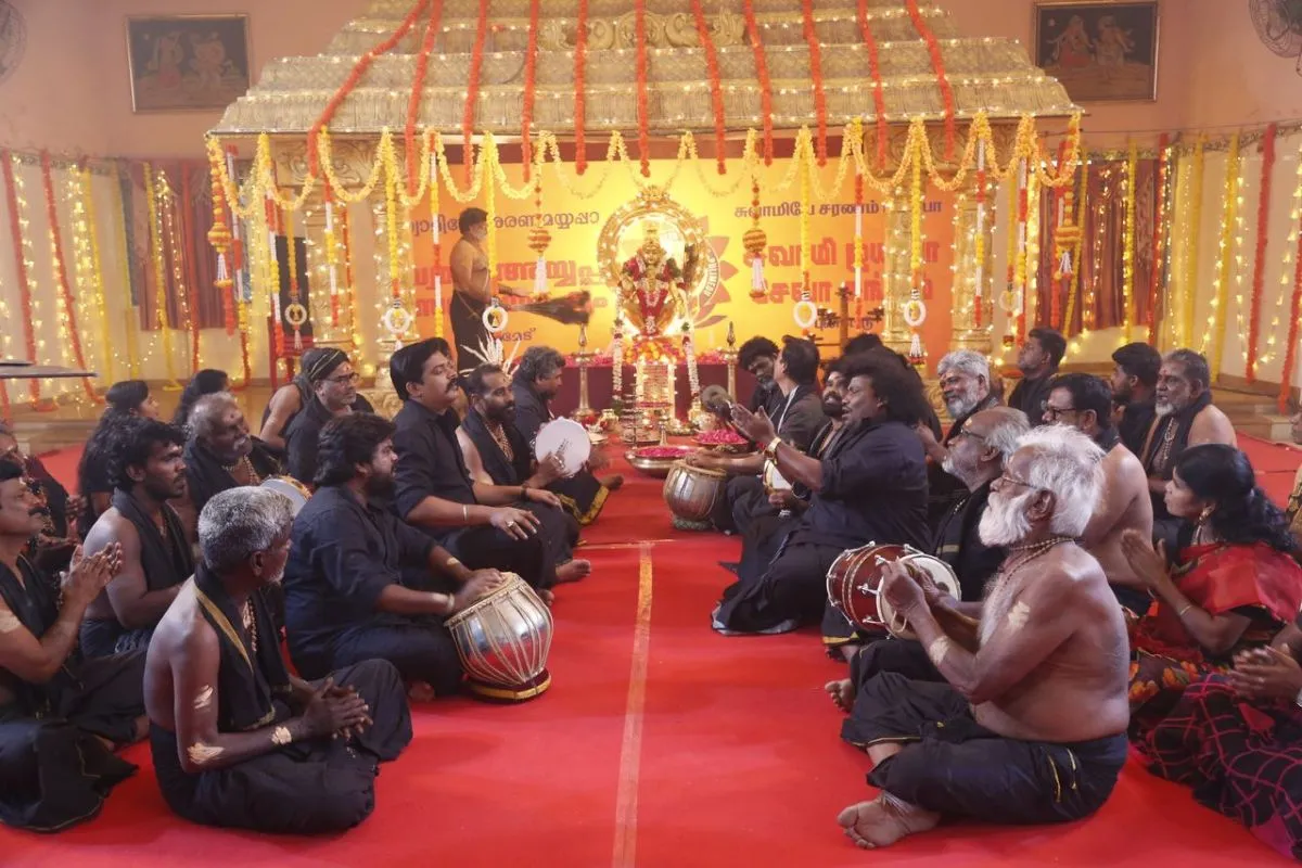 Ensemble bhajan scene from Sannidhanam (P.O) shot around a decorated Ayyappa shrine