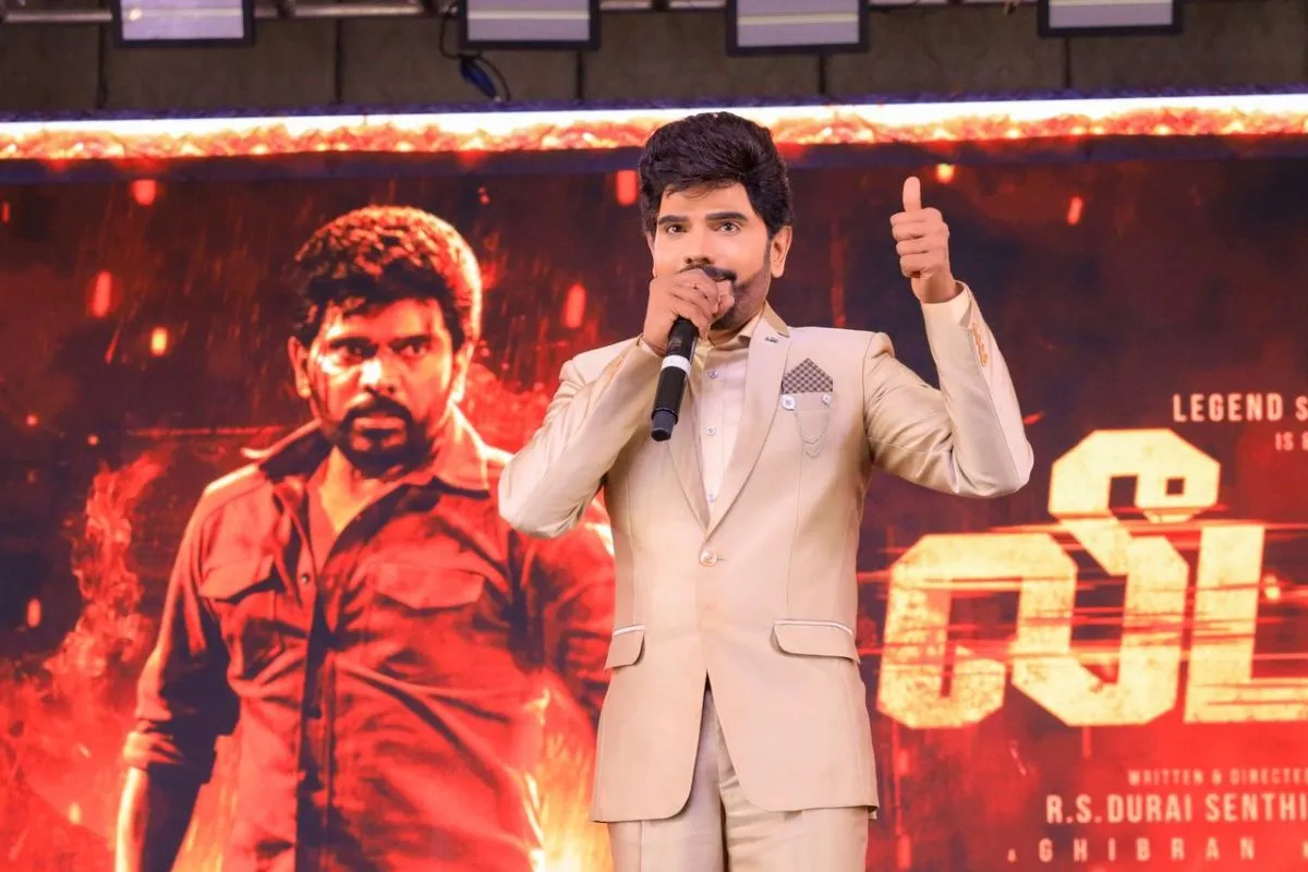 Legend Saravanan gives a thumbs up at the Leader event