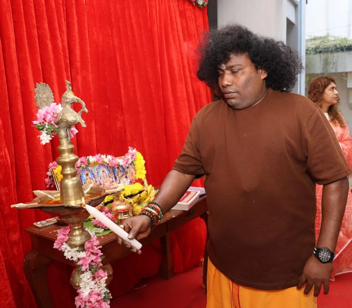 Yogi Babu at the puja altar during the An Ordinary Man launch