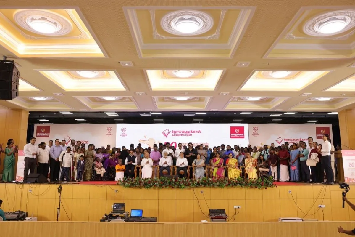 All 50 Joy Homes beneficiary families gathered on stage at the handover ceremony