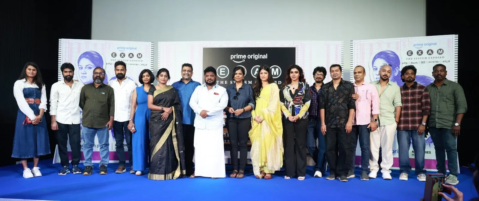 The full Exam cast and crew on stage at the trailer launch.