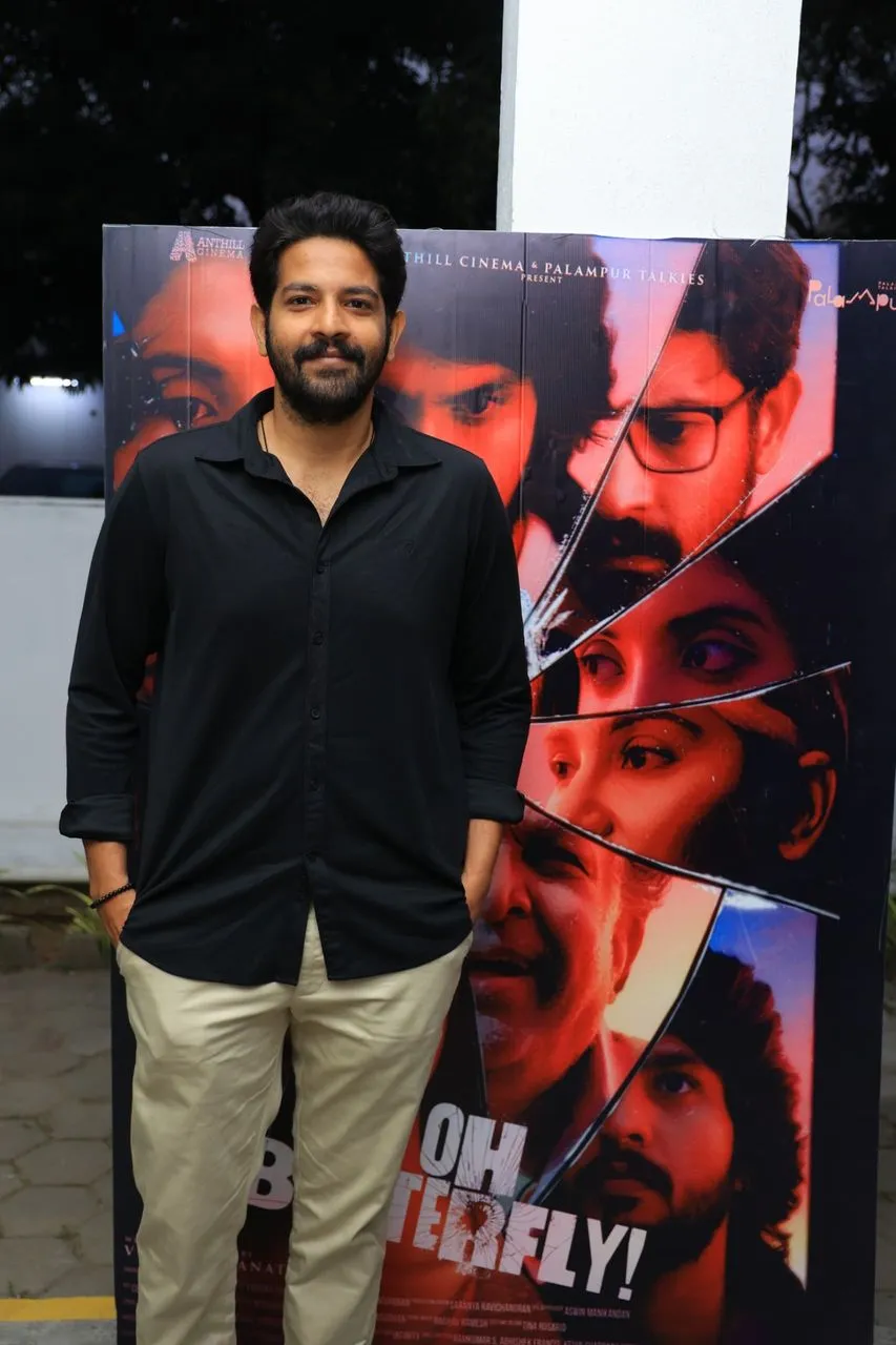 Actor Attul at the Oh Butterfly press meet with film poster