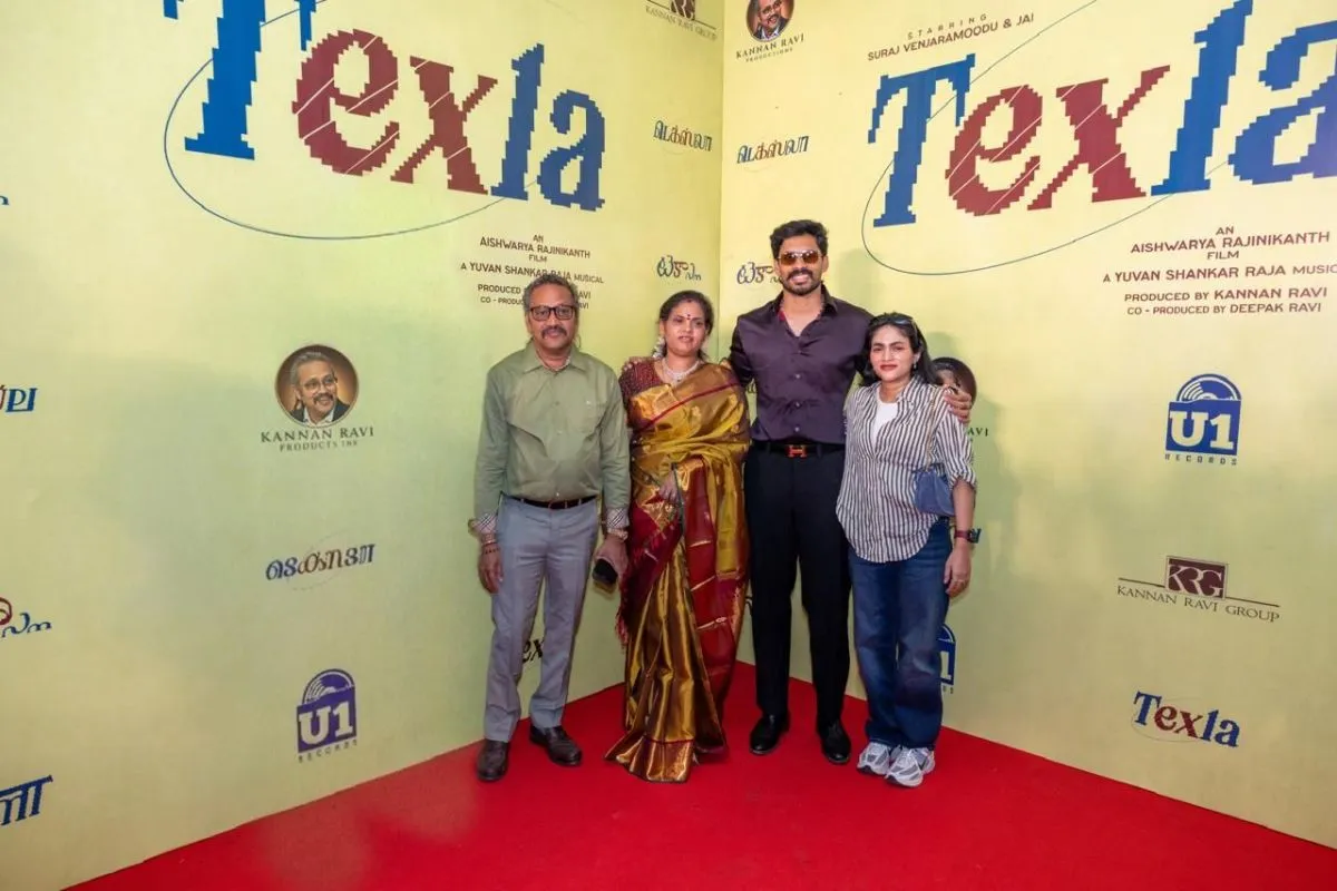 Actor Jai with family at the Texla red carpet with the film's title backdrop